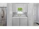 Efficient laundry area features a washer, dryer, and ample storage space at 1324 Maxwell St, North Charleston, SC 29405