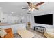 Cozy living room features a large TV, comfortable seating, and an open floor plan to the kitchen at 1324 Maxwell St, North Charleston, SC 29405