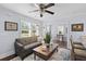 Bright living room featuring hardwood floors, stylish furniture, and ample natural light at 1324 Maxwell St, North Charleston, SC 29405