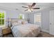 Bright and airy bedroom features two windows, lamps, and comfortable furnishings at 1324 Maxwell St, North Charleston, SC 29405