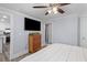 Comfortable bedroom with ample natural light, a TV, and access to the ensuite bath at 1324 Maxwell St, North Charleston, SC 29405