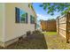 The side yard shows the home's siding and garden at 1324 Maxwell St, North Charleston, SC 29405
