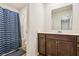 Bathroom features a shower, toilet, sink, large mirror, vanity and dark cabinets at 136 Pontoria Dr, Summerville, SC 29483