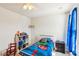 Bedroom with carpet, ceiling fan, window, small shelving unit, and a themed comforter at 136 Pontoria Dr, Summerville, SC 29483