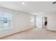 Upstairs bedroom provides plenty of sunlight with a neutral color palette and cozy carpeting at 136 Pontoria Dr, Summerville, SC 29483