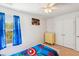 Bedroom with carpet, ceiling fan, window, blue curtains, themed comforter, and a dresser at 136 Pontoria Dr, Summerville, SC 29483