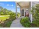 Inviting front porch with decorative touches and lush greenery enhancing curb appeal at 136 Pontoria Dr, Summerville, SC 29483
