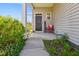 Front porch with a welcome chair, showing a cozy and inviting home entrance at 136 Pontoria Dr, Summerville, SC 29483