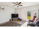 Bright living room with a ceiling fan and sliding glass doors at 136 Pontoria Dr, Summerville, SC 29483
