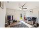 Cozy living room boasts a ceiling fan and sliding door to the yard at 136 Pontoria Dr, Summerville, SC 29483
