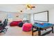 Game room features a movie screen, comfortable furniture, and a ceiling fan at 136 Pontoria Dr, Summerville, SC 29483
