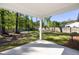 Covered patio overlooking a spacious backyard with a wooden fence, perfect for outdoor activities at 1411 Thin Pine Dr, Johns Island, SC 29455