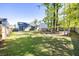 Large, well-maintained backyard with a privacy fence and mature trees offering shade and seclusion at 1411 Thin Pine Dr, Johns Island, SC 29455