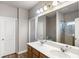 Bathroom with double sinks, a large mirror, and a shower with a glass door at 1411 Thin Pine Dr, Johns Island, SC 29455