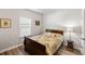 Cozy bedroom with a classic wooden frame bed and a view from the window at 1411 Thin Pine Dr, Johns Island, SC 29455