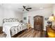 Comfortable bedroom featuring a ceiling fan, stylish furniture, and wood-look flooring at 1411 Thin Pine Dr, Johns Island, SC 29455
