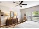 Bright bedroom with a ceiling fan, a window overlooking the lawn, and natural light at 1411 Thin Pine Dr, Johns Island, SC 29455