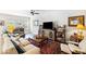 Cozy living room featuring a ceiling fan, comfortable seating, and a decorative rug at 1411 Thin Pine Dr, Johns Island, SC 29455