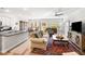 Inviting living space showcasing comfortable seating, a large window, and hardwood floors at 1411 Thin Pine Dr, Johns Island, SC 29455