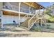 Lovely backyard with a ground patio and stairs up to a screened porch, perfect for enjoying the outdoors at 1481 Battery Reynolds Ct, Charleston, SC 29412