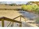Expansive backyard features a fire pit with seating and lovely waterfront views from the deck at 1481 Battery Reynolds Ct, Charleston, SC 29412