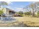 Expansive backyard with a ground patio, fire pit, screened porch, and lush surroundings at 1481 Battery Reynolds Ct, Charleston, SC 29412