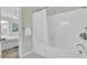 Bathroom with tiled floor, tub, shower, and open view to bedroom at 1481 Battery Reynolds Ct, Charleston, SC 29412