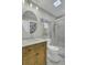 Updated bathroom features a stylish vanity, a round mirror, and a glass-enclosed shower at 1481 Battery Reynolds Ct, Charleston, SC 29412
