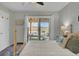 Well lit bedroom features a queen bed and sliding glass doors to the outdoor porch at 1481 Battery Reynolds Ct, Charleston, SC 29412