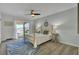 Stylish bedroom features a queen bed, ceiling fan, and sliding glass doors to the outdoor porch at 1481 Battery Reynolds Ct, Charleston, SC 29412