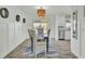Charming dining area with white walls, stylish decor, and sliding doors leading to the backyard at 1481 Battery Reynolds Ct, Charleston, SC 29412