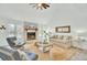 Bright living room features vaulted ceilings, a stone fireplace, and a neutral color palette at 1481 Battery Reynolds Ct, Charleston, SC 29412