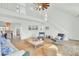Spacious and bright living room with open floor plan and staircase to the second story at 1481 Battery Reynolds Ct, Charleston, SC 29412