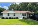 Charming single-story home boasts a well-manicured lawn and inviting curb appeal at 1487 Woodview Ln, Charleston, SC 29412