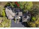 An aerial view showcases a beautiful home nestled among lush greenery with a private driveway at 1502 Marsh Haven, Seabrook Island, SC 29455