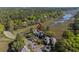 A neighborhood surrounded by marshland and mature trees, as seen from an aerial perspective at 1502 Marsh Haven, Seabrook Island, SC 29455
