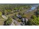 High-angle view of homes surrounded by marsh, trees, and winding roads at 1502 Marsh Haven, Seabrook Island, SC 29455