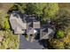 An aerial view showcases a beautiful home nestled among lush greenery with a private driveway at 1502 Marsh Haven, Seabrook Island, SC 29455