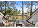 Relaxing balcony with seating area overlooking serene marsh views and lush greenery, perfect for enjoying the outdoors at 1502 Marsh Haven, Seabrook Island, SC 29455