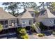 View of home exterior featuring raised deck with seating and private entrance at 1502 Marsh Haven, Seabrook Island, SC 29455