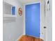 Bright foyer featuring a blue door, hardwood floors, and decorative accents at 1502 Marsh Haven, Seabrook Island, SC 29455