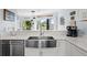Bright kitchen featuring stainless steel appliances, marble countertop and a view of the outdoors at 1502 Marsh Haven, Seabrook Island, SC 29455