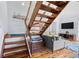 Bright open-concept living space featuring hardwood floors and a staircase with wooden treads at 1502 Marsh Haven, Seabrook Island, SC 29455