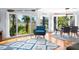 Bright living room with marsh views, stylish furniture, and hardwood floors, creating a cozy and inviting atmosphere at 1502 Marsh Haven, Seabrook Island, SC 29455