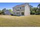 Large backyard with green lawn, patio, and ample space for outdoor activities at 1518 Stanwick Dr, Johns Island, SC 29455