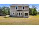 View of the home's backyard featuring a well-maintained lawn and a patio area at 1518 Stanwick Dr, Johns Island, SC 29455