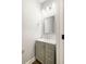Elegant half bathroom with custom gray vanity and modern fixtures at 1518 Stanwick Dr, Johns Island, SC 29455