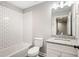 Bright bathroom features a white subway tile shower-tub, granite vanity, and modern fixtures at 1518 Stanwick Dr, Johns Island, SC 29455