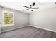 Spacious bedroom with a ceiling fan and a view overlooking the trees at 1518 Stanwick Dr, Johns Island, SC 29455