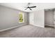 Bright bedroom has soft gray carpet and a large window at 1518 Stanwick Dr, Johns Island, SC 29455